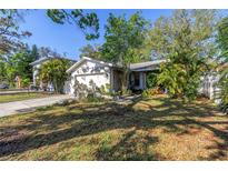 Charming single-story home featuring a well-manicured lawn and attached two-car garage at 7016 2Nd N St, St Petersburg, FL 33702