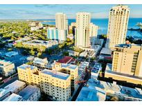 Stunning aerial view of the building and surrounding city skyline with beautiful water views in the distance at 130 4Th N Ave # 315, St Petersburg, FL 33701