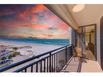 Enjoy breathtaking ocean views from this private balcony with black railing, creating a serene coastal retreat at 3820 Gulf Blvd # 802, St Pete Beach, FL 33706
