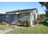 Charming single story home with a well-manicured lawn and inviting front entrance at 408 Gloucester Blvd # 33, Sun City Center, FL 33573