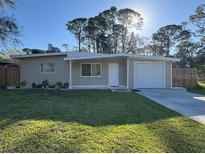 Charming single-story home with a well-maintained lawn and inviting curb appeal at 7126 Oelsner St, New Port Richey, FL 34652