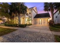 Charming two-story home with a well-maintained yard, two-car garage and beautiful landscaping at 14123 Barrington Stowers Dr, Lithia, FL 33547