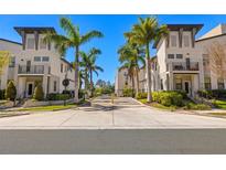Attractive community entrance with palm trees, well-maintained landscaping, and controlled access gate at 2570 12Th N Pl, St Petersburg, FL 33713