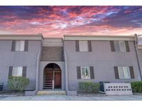 Charming exterior of a two-story condo with shutters and well maintained landscaping at 4004 Cortez Dr # D, Tampa, FL 33614