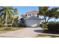 Beautiful two-story home with a tile roof, brick driveway and well-maintained landscaping at 7279 Maidencane Ct, Seminole, FL 33777