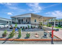 Charming single-story home featuring a well-maintained yard and inviting carport at 328 S Port Royal Ln, Apollo Beach, FL 33572