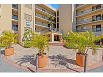 Beautiful exterior of a condo building, featuring well-manicured landscaping and a welcoming entrance at 90 S Highland Ave # 1317, Tarpon Springs, FL 34689