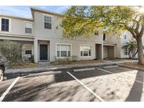 Charming townhome showcasing a well-maintained exterior and convenient parking spaces at 6709 Lake Rochester Ln, Gibsonton, FL 33534