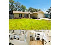 Exterior home and modern kitchen with white cabinets and stainless steel appliances at 10320 White Cedar St, Port Richey, FL 34668