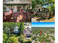 Charming porch with brick columns and steps, perfect for enjoying the outdoors at 3106 E 25Th Ave, Tampa, FL 33605