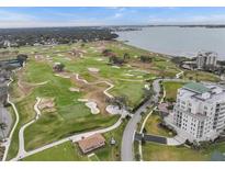Stunning aerial view of the golf course, bay and surrounding area with high rise condos near the water at 220 Belleview Blvd # 701, Belleair, FL 33756