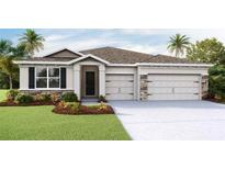 Charming single-story home featuring a two-car garage, manicured lawn, and stone accents at 4032 Harvest Hearth Pl, Plant City, FL 33565