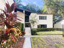 Inviting two-story condo featuring well-maintained landscaping, adding to the curb appeal at 700 Starkey Rd # 821, Largo, FL 33771