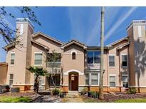 Charming multi-level condo exterior with a neutral color palette and a well-manicured front yard at 17965 Villa Creek Dr, Tampa, FL 33647