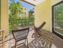 Cozy balcony with outdoor seating and garden view, perfect for relaxing and enjoying the fresh air at 1810 E Palm Ave # 6104, Tampa, FL 33605