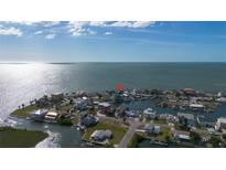 Beautiful aerial view of waterfront homes with private docks in a coastal community with ocean access at 3192 Gulf Winds Cir, Hernando Beach, FL 34607