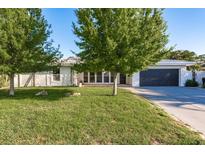 Charming single-story home featuring a well-manicured lawn and mature trees providing ample shade at 4127 53Rd S Ave, St Petersburg, FL 33711