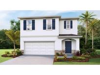 Charming two-story home with blue shutters, a two-car garage, and beautifully landscaped front yard at 6947 Broad River Ave, Land O Lakes, FL 34638