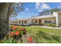 Charming single-story home with lush landscaping and a welcoming front yard at 8130 Braddock Cir # 3, Port Richey, FL 34668