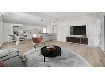 Bright living room with modern white brick wall and open floor plan at 4720 50Th N Ave, St Petersburg, FL 33714