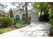 Charming single-story home with a well-manicured lawn and inviting curb appeal at 2206 Green Oaks Ln, Tampa, FL 33612