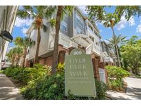 Beautiful condominium building at Hyde Park Walk with lush tropical landscaping at 800 S Dakota Ave # 221, Tampa, FL 33606