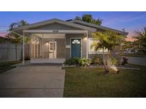 Charming single-story home featuring a screened porch, updated landscaping and a freshly painted exterior at 5758 20Th N Ave, St Petersburg, FL 33710