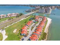 Stunning aerial view of waterfront condos, golf course, and Gulf of Mexico in beautiful Tierra Verde at 5625 Escondida S Blvd, St Petersburg, FL 33715