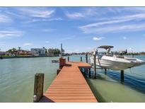 Features a private boat lift, providing direct access to the waterfront and enhancing the property's appeal for boating enthusiasts at 8032 13Th S Ave, St Petersburg, FL 33707