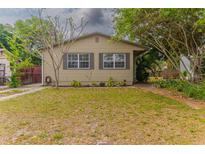 Charming single-story home with a well-maintained front yard and mature trees at 2460 16Th N Ave, St Petersburg, FL 33713