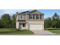 Two-story home featuring neutral siding, an attached two-car garage, and well-maintained landscaping at 11784 Brae Way, Dade City, FL 33525