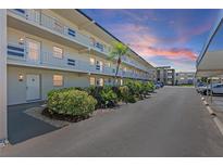Condo building with well-maintained landscaping and ample parking at 9940 47Th N Ave # 210, St Petersburg, FL 33708
