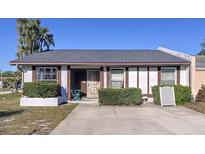 Charming single-story home with well-maintained landscaping and a cozy front patio area at 3914 41St W St, Bradenton, FL 34205