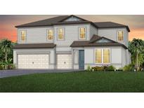 Charming two-story home featuring a two-car garage and lush landscaping at 1672 Valier Pt, Zephyrhills, FL 33541