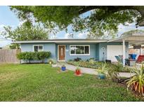 Charming single-story home with well-maintained lawn and landscaped garden beds at 1901 66Th N Ave, St Petersburg, FL 33702