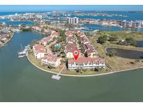 Beautiful aerial view of a waterfront condo with a private dock and access to the bay at 553 Haven Point Dr, Treasure Island, FL 33706