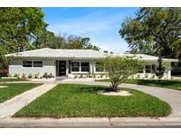 Charming single-story home featuring a landscaped front yard and a freshly painted exterior at 6531 2Nd N Ave, St Petersburg, FL 33710