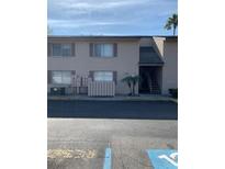 Charming condo with a two-story design, tidy landscaping, and convenient parking at 7526 Needle Leaf Pl # 30, Tampa, FL 33617