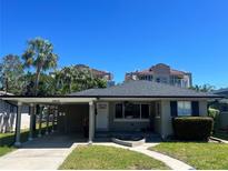Charming single-story home featuring a carport and well-maintained front yard in a quiet neighborhood at 3503 Casablanca Ave, St Pete Beach, FL 33706