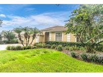 Charming single-story home featuring a well-manicured front yard and three-car garage at 17503 Edinburgh Dr, Tampa, FL 33647