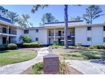 Inviting two-story condo complex with well-manicured landscaping at 5019 Mill Pond Rd # 3128, Wesley Chapel, FL 33543