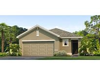 Charming single-story home featuring a neutral color scheme, a two-car garage, and well-maintained landscaping at 5519 Warrington Town Pass, Wesley Chapel, FL 33545