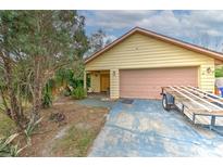 Charming single-story home features a two-car garage and well-maintained front yard at 1617 Cherokee Trl, Valrico, FL 33594