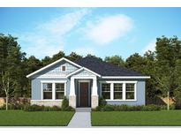 Charming single-story home featuring a stone accent and light blue painted siding at 28842 Hillcrest Valley Blvd, Wesley Chapel, FL 33543