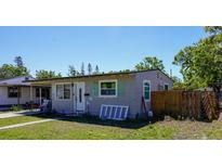 Modest single-story home with mature trees and front lawn at 4236 11Th S Ave, St Petersburg, FL 33711