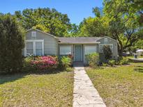 Charming single-story home with a well-maintained front yard and inviting walkway at 1401 E North St, Tampa, FL 33604