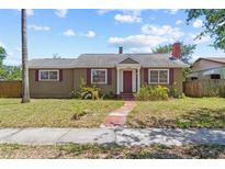 Charming single-story home with a brick walkway, chimney, and red shutters, perfect for a cozy lifestyle at 3124 9Th N Ave, St Petersburg, FL 33713
