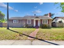 Charming home featuring a well-maintained front yard, brick walkway, and neutral exterior paint scheme at 3124 9Th N Ave, St Petersburg, FL 33713