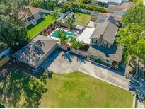 Expansive aerial view of home highlighting pool, yard, and driveway at 8205 Overlook Ne Pl, St Petersburg, FL 33702