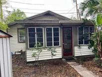 Charming single-Gathering home featuring a red door and large windows at 3029 20Th St, St Petersburg, FL 33713
